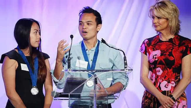 Matthew Alberto and Phuong Nguyen receiving the Pride of Australia Medal, presented by Sandra Sully